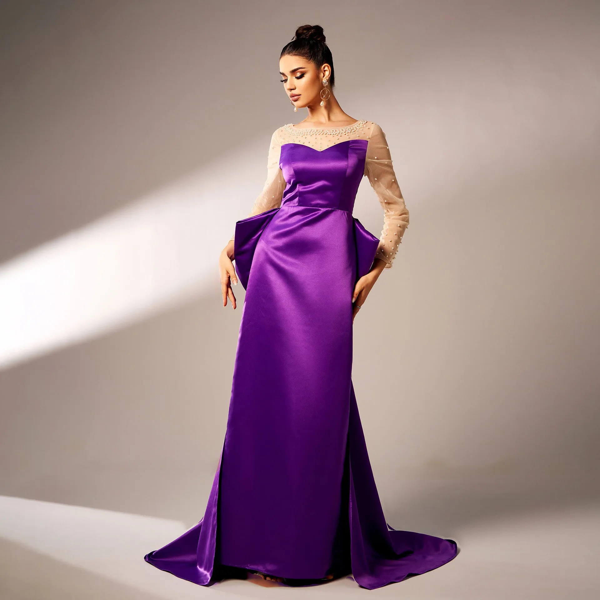 Elegant Beaded Long-Sleeve Bow-Detail Evening Gown with Dramatic Flair
