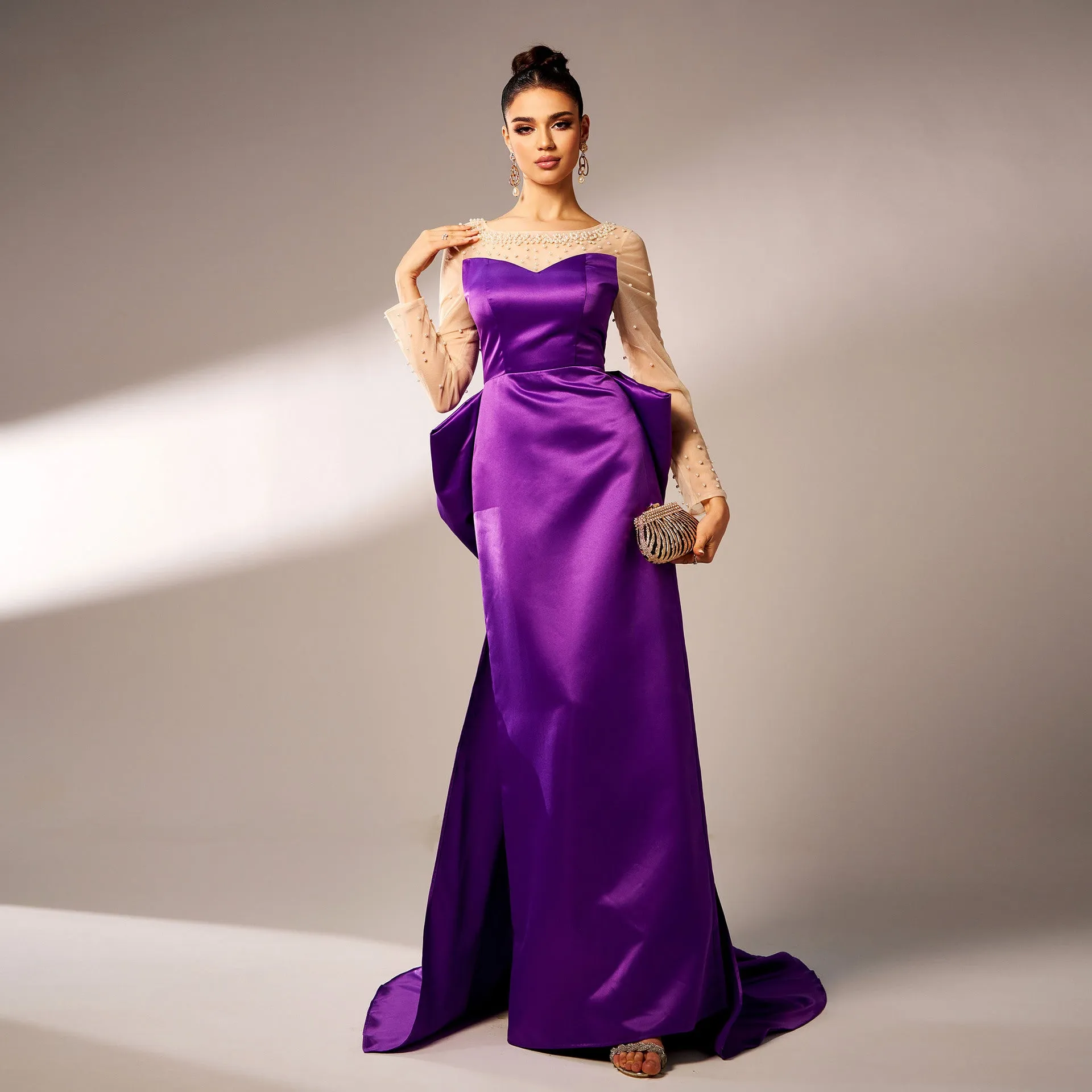 Elegant Beaded Long-Sleeve Bow-Detail Evening Gown with Dramatic Flair