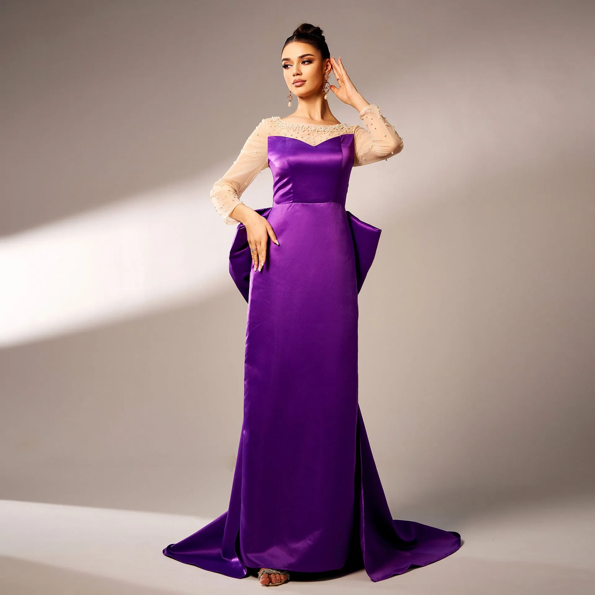 Elegant Beaded Long-Sleeve Bow-Detail Evening Gown with Dramatic Flair