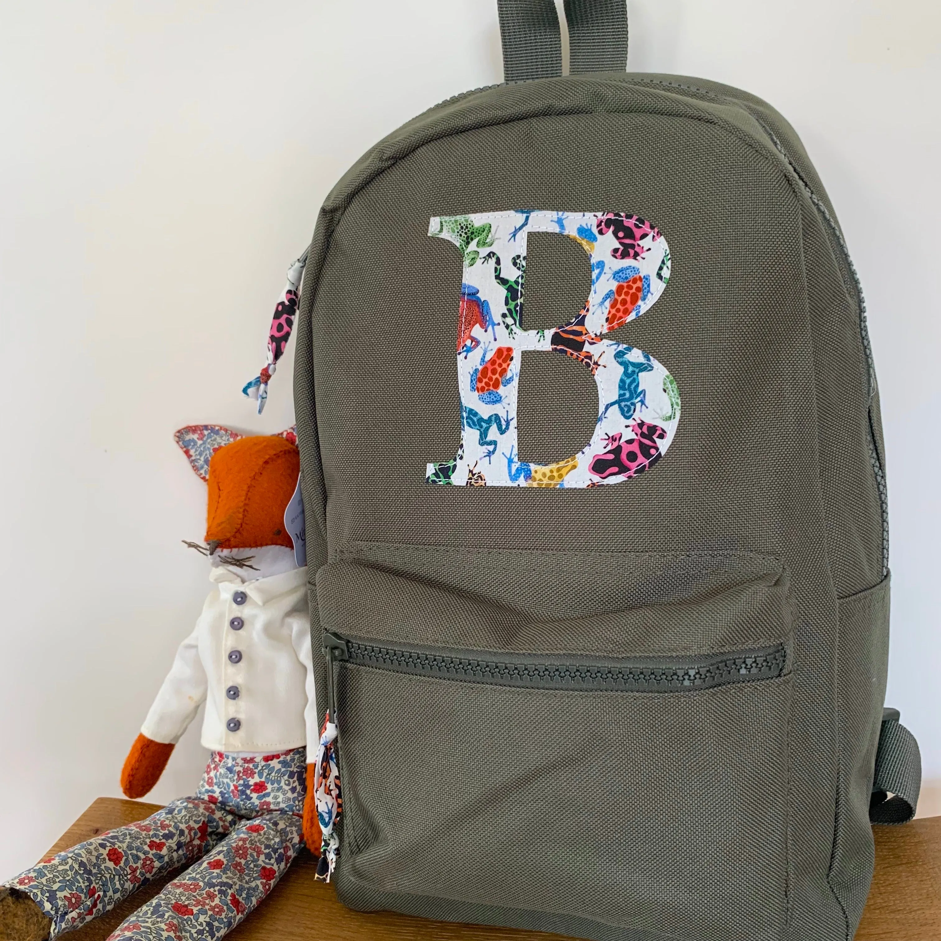 Khaki initial backpack